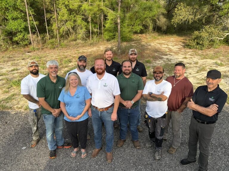 The Townsley Construction team pose for a group photo outside.