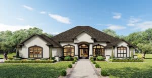 The Wyrick is a single-story suburban house with a central entryway, arched windows, and a paved walkway leading to the front door. Townsley Construction in Florida